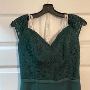 Lace crepe off-the-shoulder bridesmaid dress in David’s Bridal “Juniper”